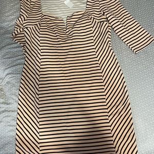Peach (pink) dress with black stripes.